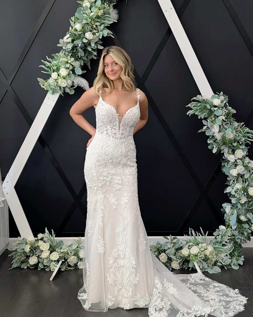 Romantic lace wedding gown with fitted bodice and train