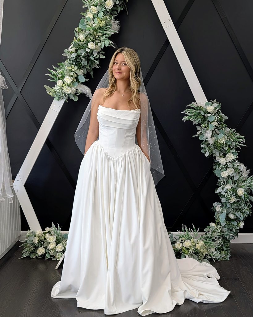 Bride wearing a clean satin wedding gown at Catherine's Bridal Boutique in Valparaiso Indiana
