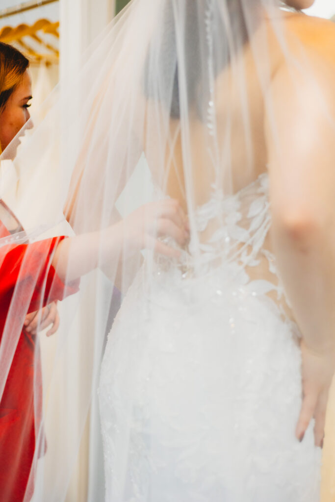 A bride meeting with the seamstress for alterations at Catherine's Bridal Boutique, a bridal shop in Valparaiso Indiana 